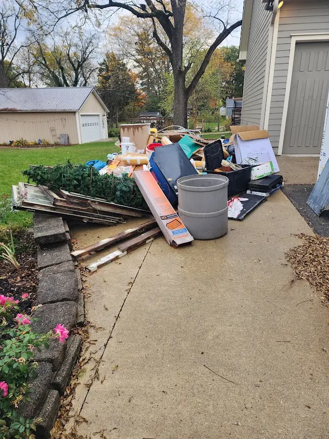 Dumpster being loaded with debris for Roofing Dumpster Rental in Gilberts